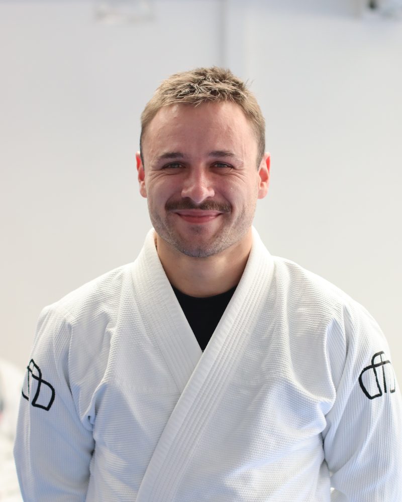 Phillip, BJJ-Blaugurt, im Gi auf der Matte im Imperial Ground